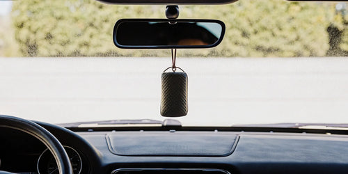 The best smelling car air freshener from a subscription service hanging from a rearview mirror.