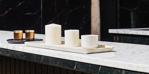 A collection of the best coffee scented candles for a cozy café vibe.