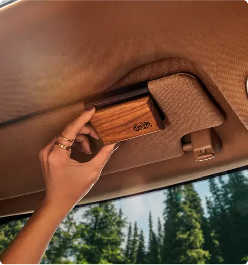 Wood Car Freshener by Drift on a car dashboard